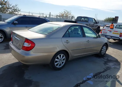 2003 Toyota Camry Xle z USA, uszkodzony, nr VIN JTDBE32K330176054